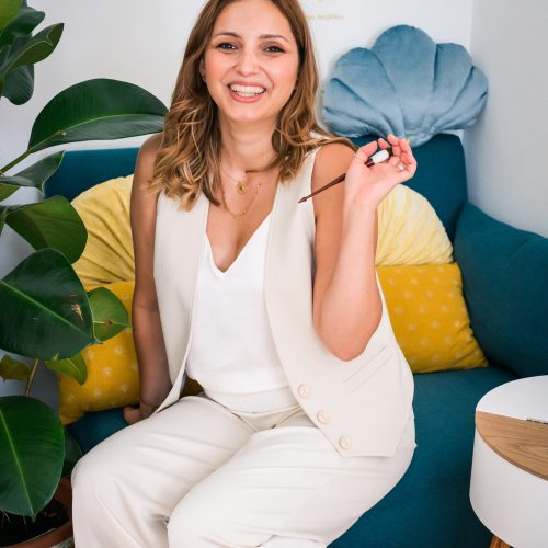 Sanda letter a calligrapher sitting on her couch